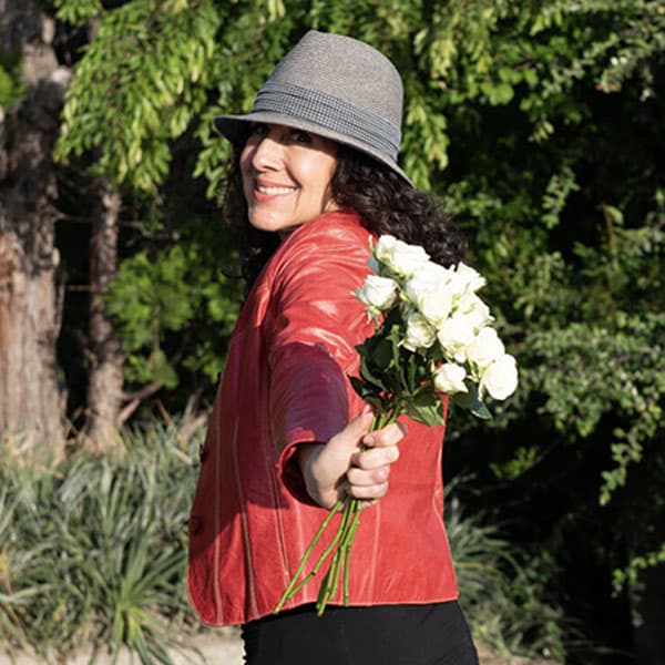 woman smiling with flowers