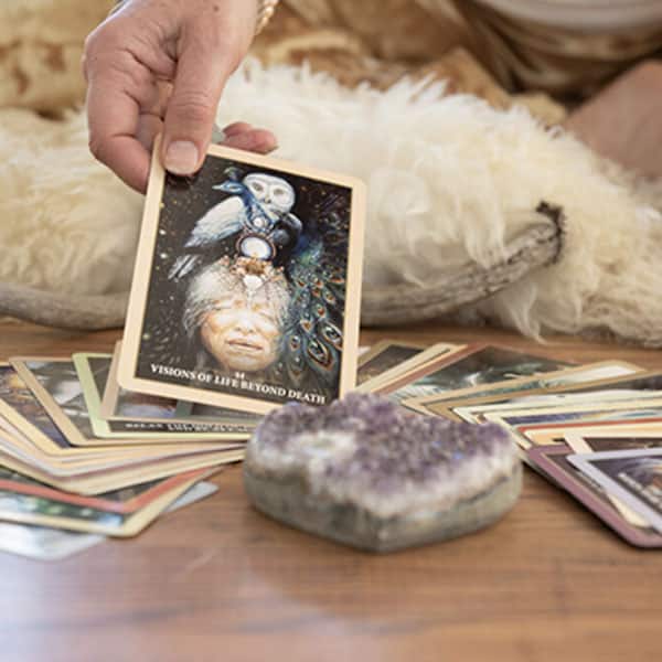 cards on the floor with a gemstone