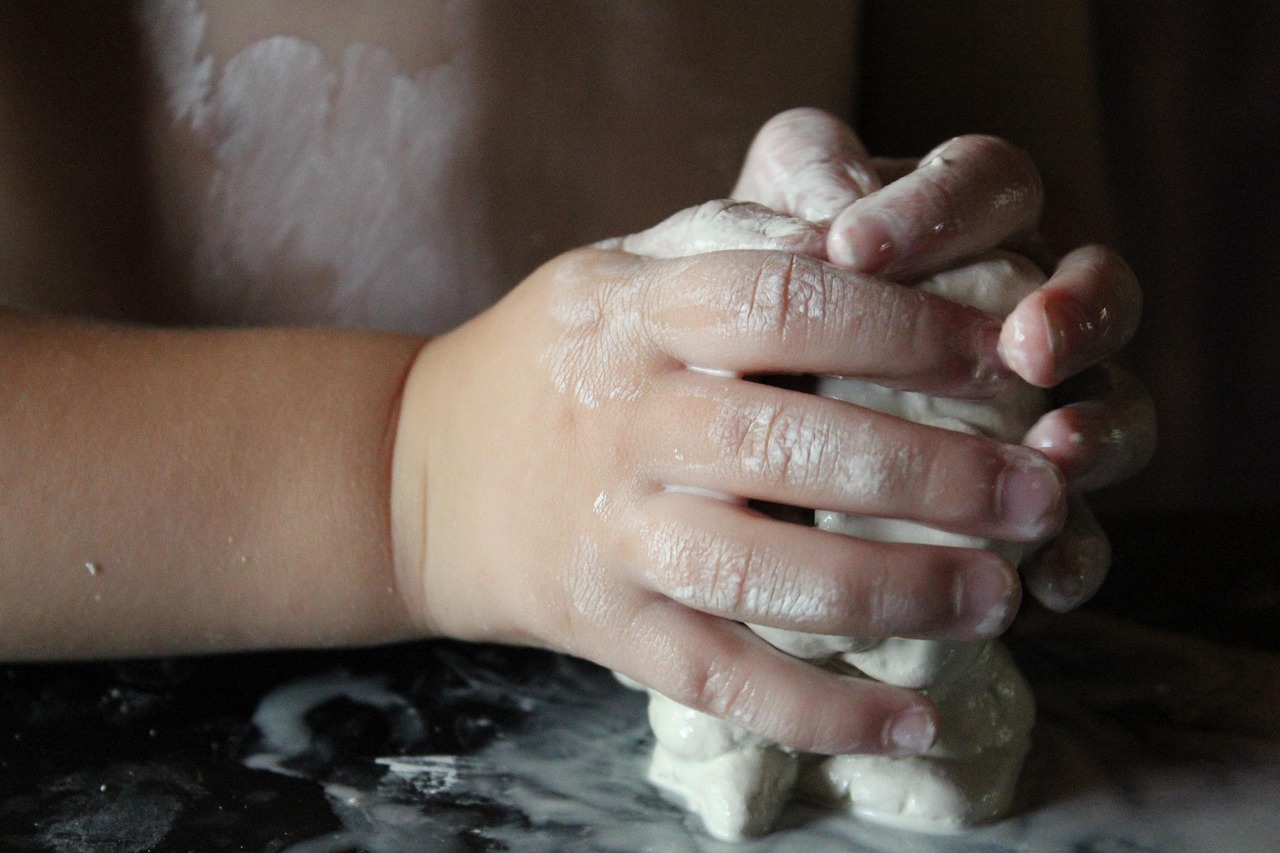 Art therapy exercise making grief vessel with clay